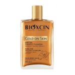 اسپری روغنی شاین صورت و بدن و مو بیوکسین Bioxcin مدل Gold On Skin حجم 100ml